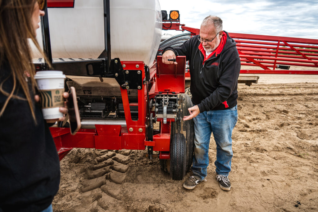 Trainer pointing to gears on Valmar machine